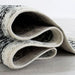 Serang Gray/Black 5' X 7' Area Rug - California Furniture (Coachella, CA)